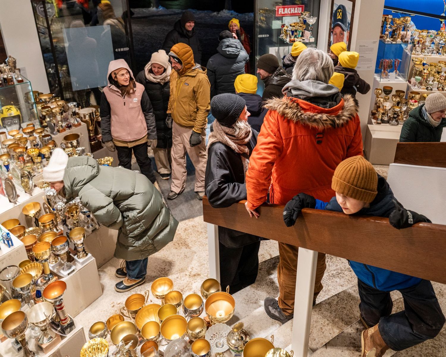 Visitors exploring snow trophies at Schneearchiv during the minus20degree biennale