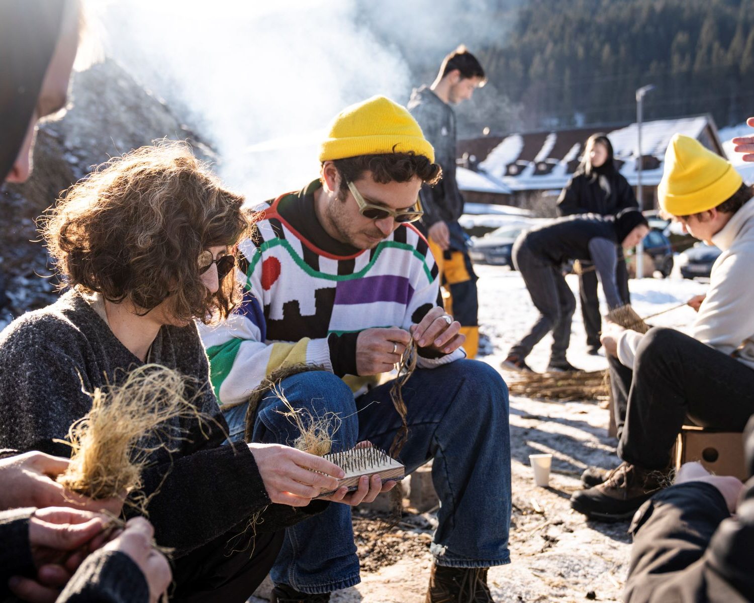Participants weaving dried nettles outdoors during Wellness Anti-Anti+ at minus20degree biennale
